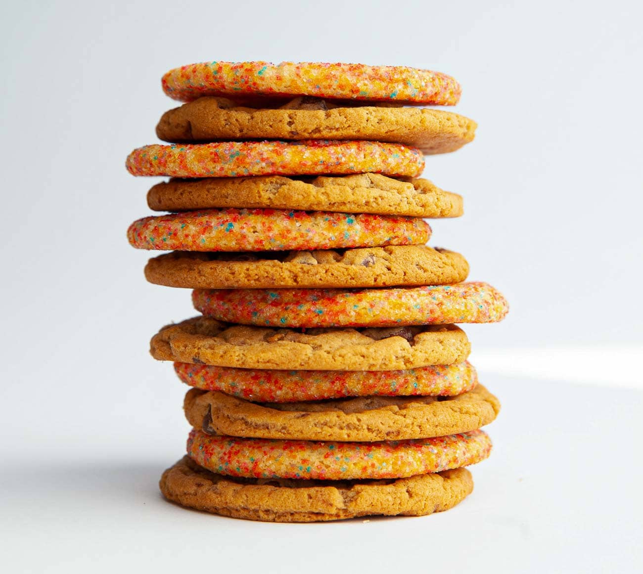 Picture of a dozen Original chocolate chip and Sugar cookies alternately stacked together